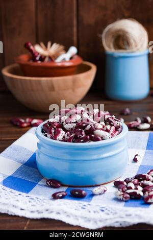 Violet with dots beans in ceramic bowl. Swallow beans. Vegetables for healthy eating. Organic food. Diet Stock Photo