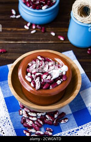 Violet with dots beans in ceramic bowl. Swallow beans. Vegetables for healthy eating. Organic food. Diet Stock Photo