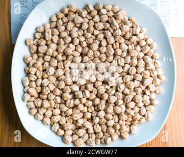 Chickpeas on the plate, close up, top view Stock Photo