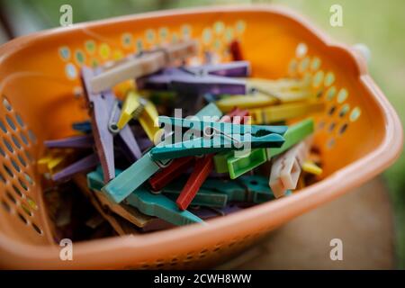 Details with a stack of plastic clothes pegs Stock Photo