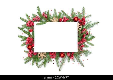 Christmas background with a frame of fir branches and Christmas tree decorations: glass balls, wooden snowflakes, viburnum berries and confetti. Chris Stock Photo