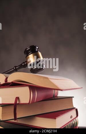 wooden hammer of a judge on a pile of books, studying law concept