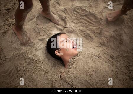 R J Hernandez 8 From El Campo Texas Is Buried In Sand As He Cools Off Near The Pacific Ocean During A Heat Wave In Santa Monica California June 28 2013 The Mercury