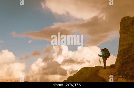 hiker on footpath in Sella Ronda mountain south Tyrol, Italy Stock Photo
