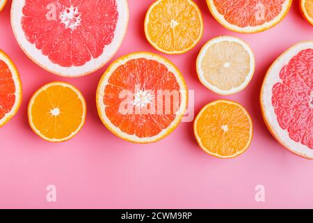 Flat lay composition with halves of different citrus fruits Stock Photo