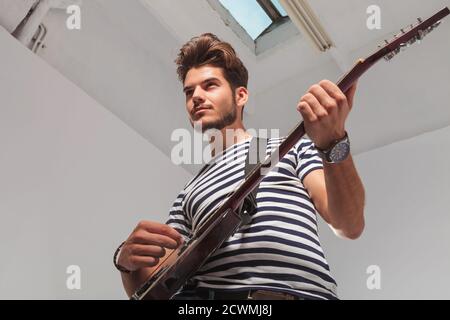 Young Man Playing Guitar In Photo Picture And HD Photos | Free Download On  Lovepik
