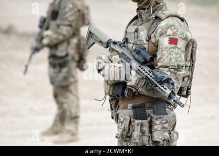 Soldiers with machine gun and flag of Bahrain on military uniform. Collage. Stock Photo