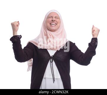 Happy Excited Muslim Woman Celebrating Success over White Background Stock Photo