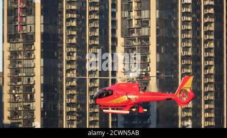 Melbourne Australia : Modern city living. A helicopter flies past apartments in Docklands Melbourne . Stock Photo