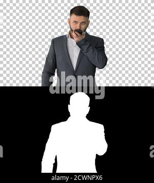 Turk businessman using smartphone's digital voice assistant, Alp Stock Photo