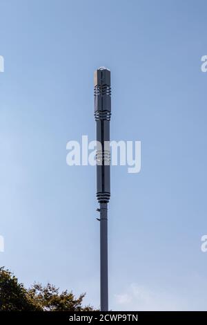 A 5G mobile phone mast or cell phone mast in the street Stock Photo