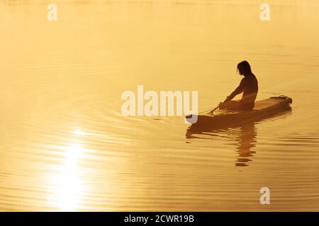 Silhouette of young male surfer on the beach at sunset Stock Photo - Alamy