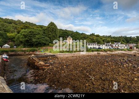 Corrie Port is a small harbour in the pretty seaside village of Corrie on the Isle of Arran, Scotland. Stock Photo