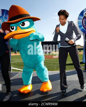 U S First Lady Michelle Obama Dances The Platypus Walk With Perry The Platypus From The Children S Tv Show Phineas And Ferb During A Let S Move Faith And Communities Physical Activity At Disney World S Espn Wide World Of Sports In Orlando Florida