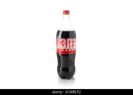 Coca Cola bottle. Carbonated non-alcoholic drink. On White Background. Stock Photo