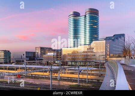 Utrecht, Netherlands cityscape over train station platforms at dawn. Stock Photo