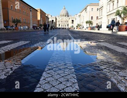 Rome, Italy. October 16, 2019. St. Peter’s Basilica (Vatican City) puddle reflection. Stock Photo