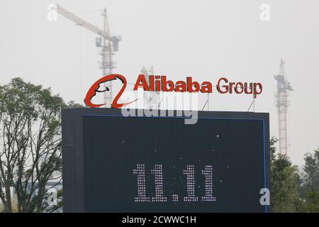 The logo of the Alibaba Group is seen inside the company's headquarters in Hangzhou, Zhejiang province November 11, 2014. The '11.11 Shopping Festival', which Alibaba says is the world's biggest 24-hour online sale, began in 2009 when just 27 merchants on the company's Tmall.com site offered deep discounts to boost sales during an otherwise slack period. REUTERS/Aly Song (CHINA - Tags: BUSINESS SCIENCE TECHNOLOGY)