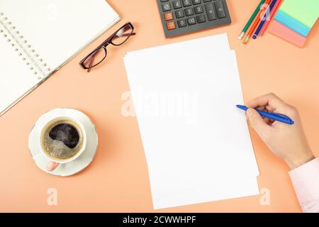 Man working on stylish table desk, workspace. Clipboard mockup template paperwork, financial reports,resume, brief, form, contract. Top view. Flat lay Stock Photo