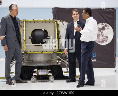 Commercial Lunar Payload Services Announcement NASA Associate Administrator, Science Mission Directorate, Thomas Zurbuchen, left, speaks to, President and CEO of OrbitBeyond, Siba Padhi, right, and Chief Science Officer, OrbitBeyond, Jon Morse, about their lunar lander, Friday, May 31, 2019, at Goddard Space Flight Center in Md. Astrobotic, Intuitive Machines, and Orbit Beyond have been selected to provide the first lunar landers for the Artemis program's lunar surface exploration. '