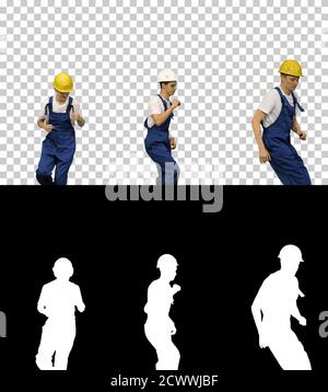 Three male construction workers in hard hats dancing in free sty Stock Photo