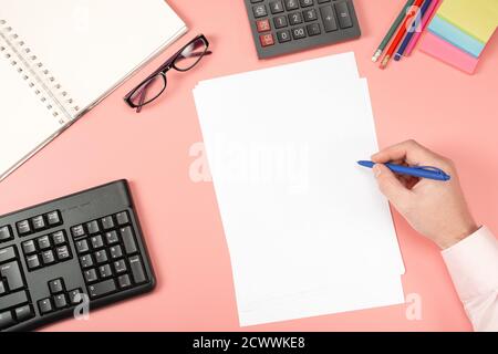 Businessman working with documents. Clipboard mockup template paperwork, financial reports, resume, modern pink office Desk Stock Photo