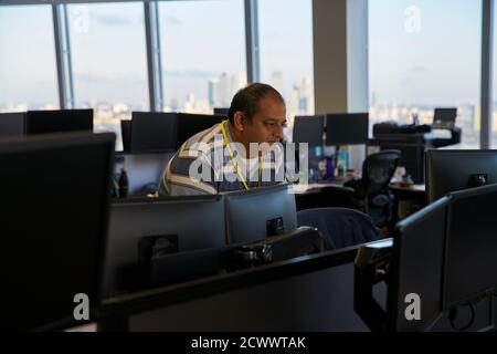 Businessman working at computer in office Stock Photo