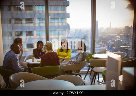 Business people meeting in urban highrise office cafeteria Stock Photo