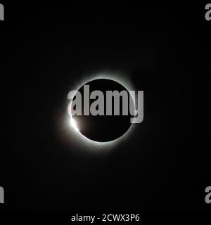 Total Solar Eclipse - July 2, 2019 The diamond ring effect is seen during a total solar eclipse on Tuesday, July 2, 2019, directly over the National Science Foundation’s (NSF) Cerro Tololo Inter-American Observatory. The observatory is located in the foothills of the Andes, 7,241 feet (2200 meters) above sea level in the Coquimbo Region of northern Chile. A total and partial solar eclipse was visible across parts of Chile and Argentina, while a partial eclipse was visible across much of South America.  As the Moon closes in over the Sun’s face and the last bits of sunlight pass through the val Stock Photo