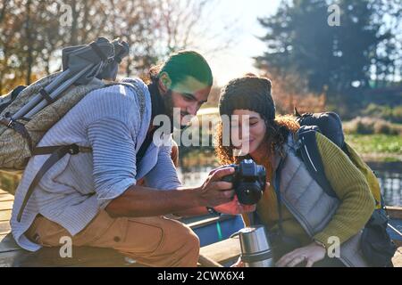 Young hiking couple using digital camera Stock Photo