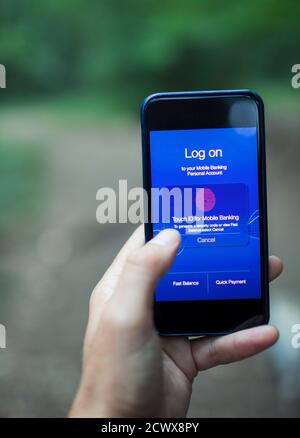 Close up POV woman using fingerprint ID on smart phone screen Stock Photo