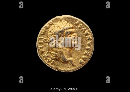 Roman gold aureus replica coin obverse of Roman Emperor Domitian AD 81-96  cut out and isolated on a black background stock photo Image Stock Photo