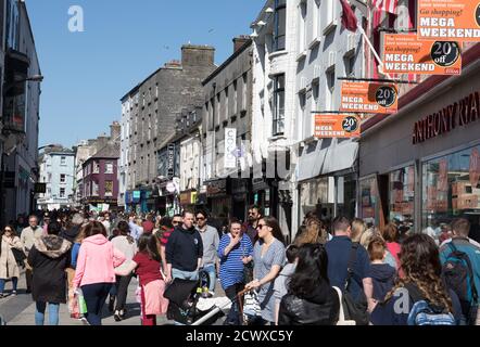 GALWAY CITY, IRELAND - 5th May, 2018: People walking on busy pedestrian Downtown area of Shop street in Galway city Stock Photo