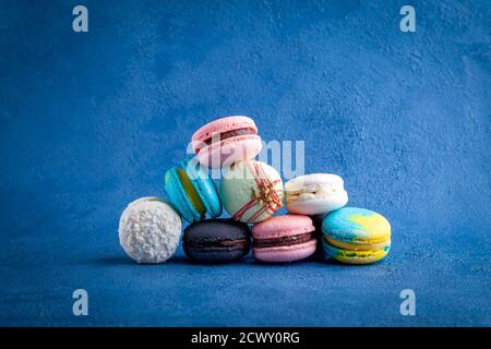 Heap of colored assortment of macarons, sweet french traditional dessert Stock Photo