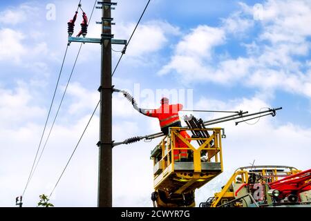 Work platform trolley with freely swivelling aerial work platform removes overhead line on the railway line Stock Photo