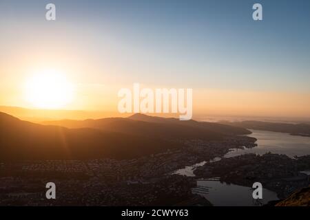 Bergen cityscape and fjord landscape aerial panorama with sunlight. Stock Photo