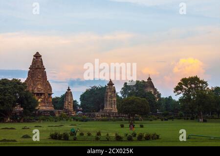 Khajuraho, Madhya Pradesh, India : Sunset view of the Vishvanatha (left) and Parvati (right) temples part of the western group of the UNESCO World Her Stock Photo