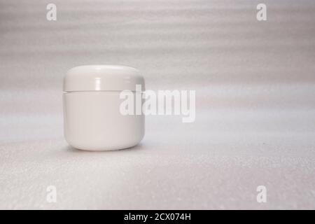 Close-up of white plastic jar with white background with white background Stock Photo