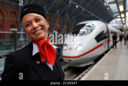 Medi Steigleder, who works on board the new ICE German high speed train, stands on the platform after it arrived at St Pancras station in London, October 19, 2010. Deutsche Bahn showcased a Siemens high-speed train in London on Tuesday which it hopes will run services to Germany through the Channel Tunnel, challenging Eurostar's monopoly and Alstom trains. The ICE 3 train, which can hit 320 kilometres per hour, was on display at London's St Pancras station following safety tests. Deutsche Bahn is aiming to operate services from London to Frankfurt and Cologne by the end of 2013. REUTERS/Andrew