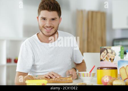 a man making a sandwhich Stock Photo