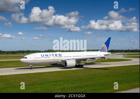Munich, Germany - September 19. 2019 : United Airlines Boeing 777-222  with the aircraft registration N219UA  is taxiing for take off on the northern Stock Photo