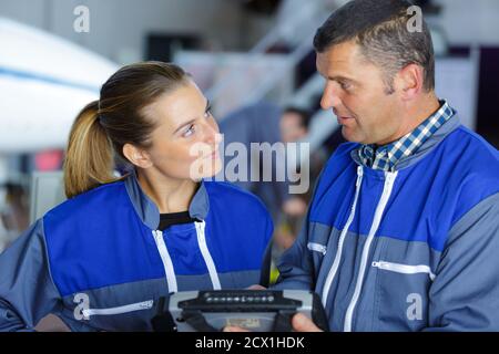 two technicians working in car service Stock Photo