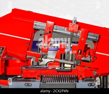 Industrial machine with a band saw for processing large metal parts, close-up. Stock Photo