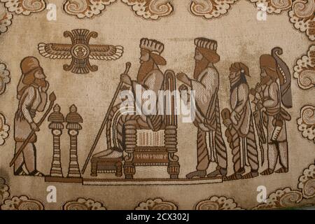 Woven textile depicting an Achaemenid scene from the northern stairs of the Apadana. Persepolis, Iran. Original relief now kept at archaeological museum, Tehran Stock Photo