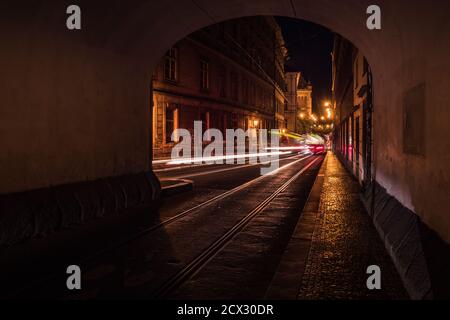 Smetanovo Nabrezi Passage in Prague at Night with Light Streaks and Reflections on the Cobblestones Stock Photo
