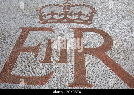 Queen Elizabeth II text on a cobble road in Gibraltar Stock Photo