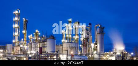 Oil refinery after sunset with lights Stock Photo