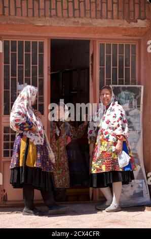 Local Abyanaki women in conversation. Abyaneh village, Barzrud Rural District, Isfahan Province, Iran Stock Photo