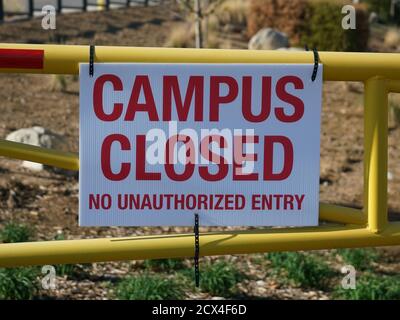 Lake Elsinore, California, USA, September 30, 2020, School campus closed sign on gate Stock Photo