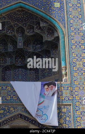 Supreme Leaders of the Islamic Revolution,  Ayatollah Ali Khamenei and Ruhollah Ruhollah Khomeini on a banner. Imam Architectural Detail. Stock Photo